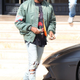 Kanye West Los Angeles November 4 2013 Kanye West leaving Barneys New York in Beverly Hills, wearing his Yeezus Tour flight jacket and driving away in his Lamborghini Aventador ID revpix131104201 All pictures must be credited revolutionpix